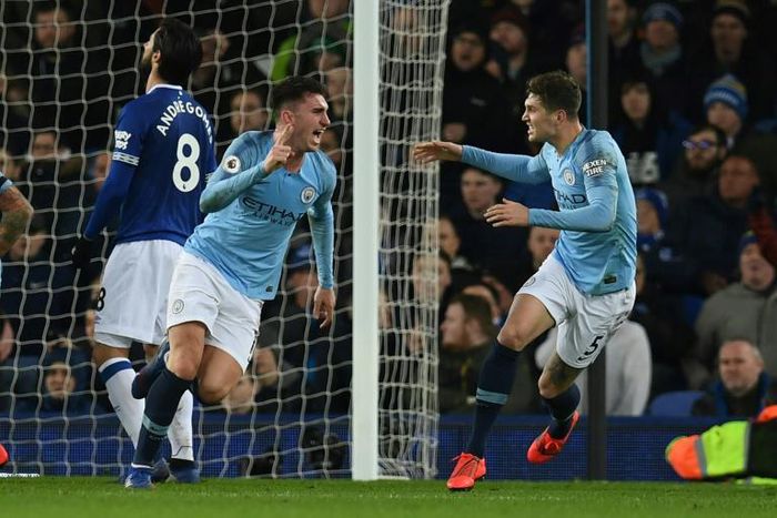Manchester City's Aymeric Laporte celebrates scoring the opening goal at Everton