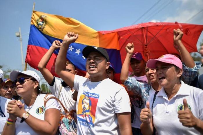 Venezuelans protest against the government of President Nicolas Maduro at a border bridge in Cucuta, Colombia