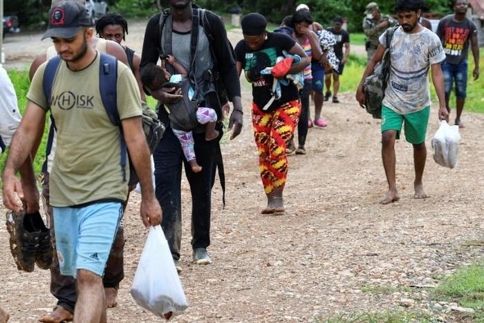 Haitian migrants arrive in Lajas Blancas, Darien province, Panama, on May 22, 2019, after walking through the jungle