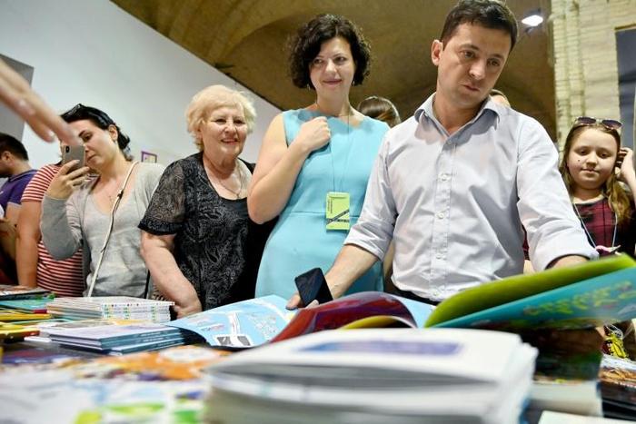 Newly elected Ukrainian President Volodymyr Zelensky at a book fair in Kiev tells AFP that his new job "has been a bit of a shock, there's a lot of work"