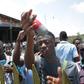 Anger: A student shows a tear gas canister thrown by riot police during a rally to protest at changes in the university grant process