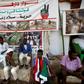 Sudanese men displaced from Darfur sit next to a tent outside the military headquarters in the capital Khartoum at the ongoing sit-in