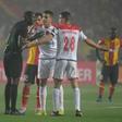Wydad Casablanca captain Abdelatif Noussir (R) argues with Gambian referee Bakary Gassama after his side had a goal disallowed during the CAF Champions League final