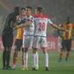 Wydad Casablanca captain Abdelatif Noussir (R) argues with Gambian referee Bakary Gassama after his side had a goal disallowed during the CAF Champions League final