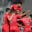 Medhi Benatia (C) is mobbed by teammates after putting Al Duhail ahead against Esteghlal