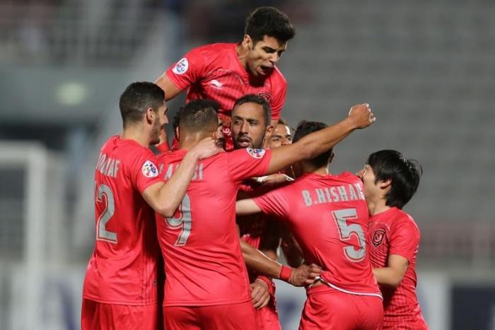 Medhi Benatia (C) is mobbed by teammates after putting Al Duhail ahead against Esteghlal