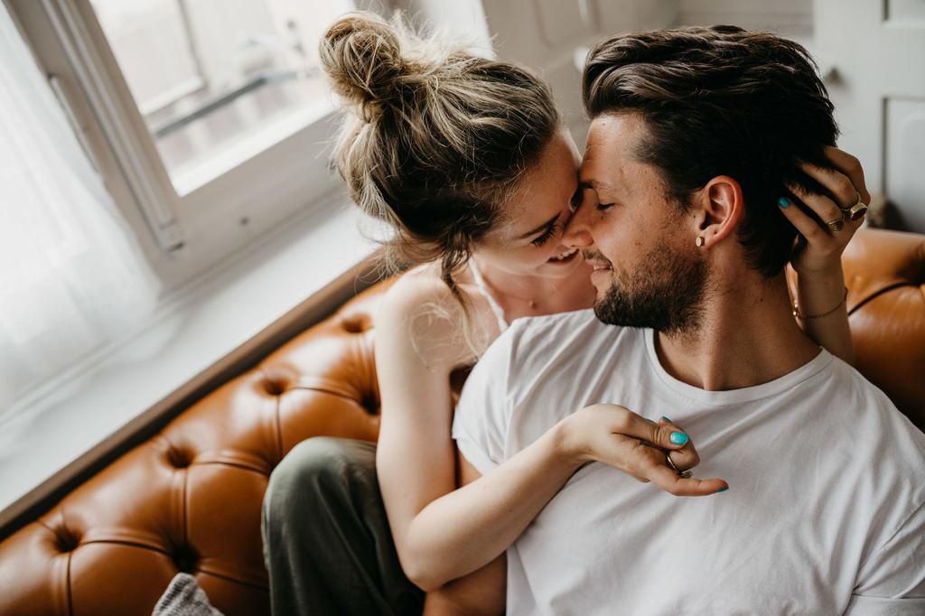 Loving Young Couple Romancing At Home