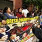 "Corrupt Congress: Nest of Rats" reads the sign held by demonstrators outside Peru's single-chamber legislature, with pictures of prominent lawmakers