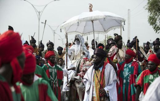The Emir of Kano (C), Muhammadu Sanusi II is at the centre of tensions between new and old styles of governance