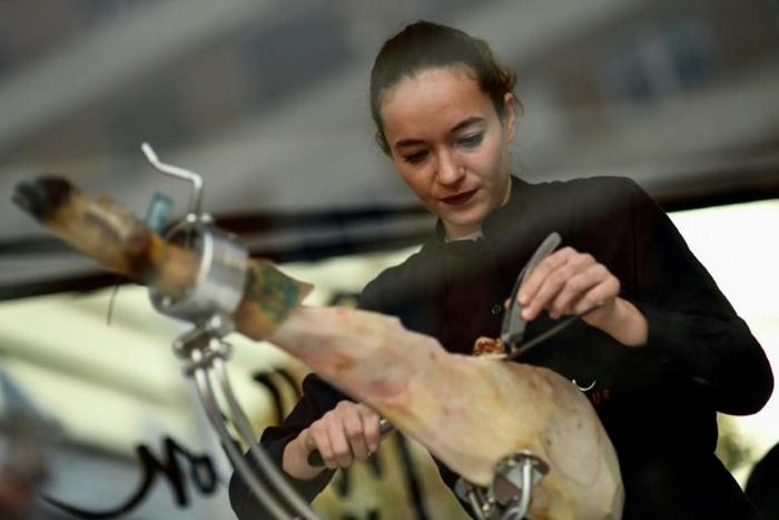 Spanish ham cutter Raquel Acosta shows her skills as more women enter the man's world of high-level cutters of Spain's famous dry-cured ham legs
