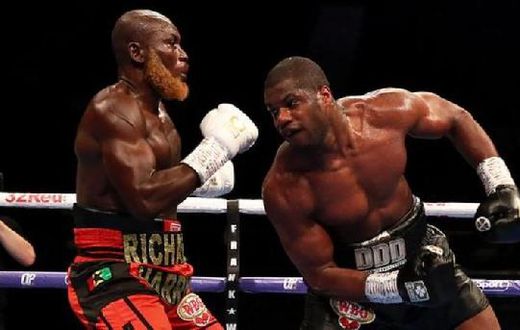 Daniel Dubois (right) sent Richard Lartey to the canvas with a powerful right hand