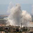 Smoke rises after a reported Syrian regime air strike on the town of Khan Sheikhun in Idlib province on on May 29, 2019