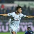 Class act: AC Milan's Krzysztof Piatek celebrates scoring on Saturday