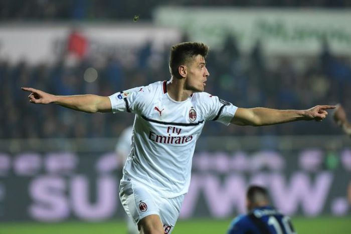 Class act: AC Milan's Krzysztof Piatek celebrates scoring on Saturday