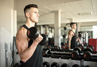 Man training biceps in gym