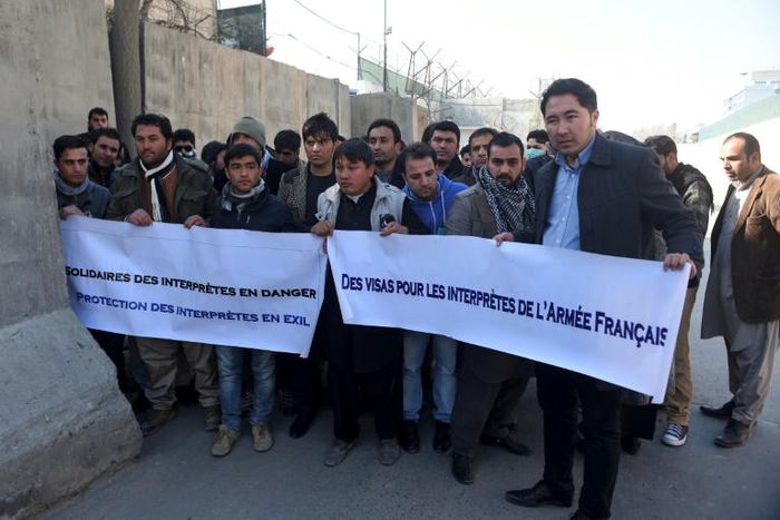 Former Afghan interpreters for the French army demonstrate in front of the French embassy in Kabul