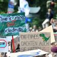 Young demonstrators urged their elders to treat climate change with greater urgency, with one banner held aloft in Berlin reminding them that "the dinosaurs also thought they had time" before they were wiped out