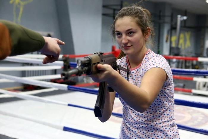 Toting dummy Kalashnikovs, young Ukrainian women receive instruction on gun handling basics and hand-to-hand combat in Mariupol, not far from the frontline with Russia-backed separatists