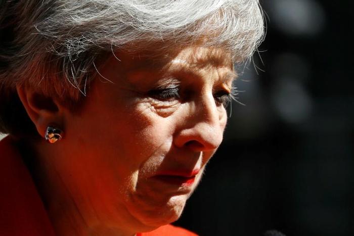Britain's Prime Minister Theresa May said she would step down as Conservative Party leader on June 7