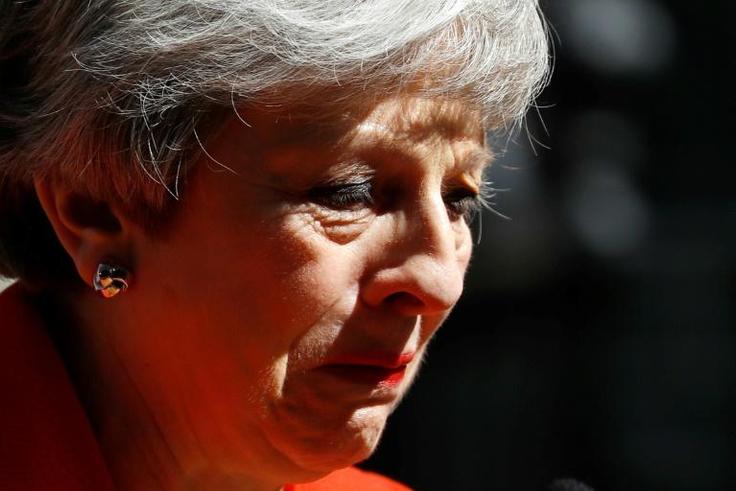 Britain's Prime Minister Theresa May said she would step down as Conservative Party leader on June 7