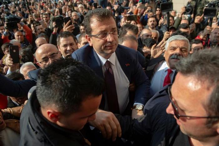 Cheering supporters packed the streets to greet opposition candidate Ekrem Imamoglu (C) at the Istanbul court where he received his mandate certificate