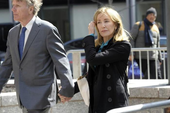 Actress Felicity Huffman did not speak to reporters as she arrived at the federal courthouse in Boston