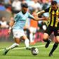 Manchester City's Algerian midfielder Riyad Mahrez (L) runs at Watford defender Jose Holebas during the FA Cup final