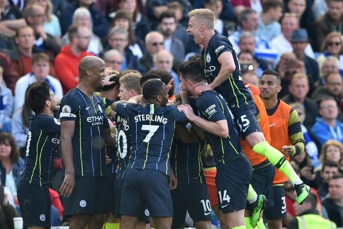 Champions again: Manchester City retained the Premier League with victory at Brighton