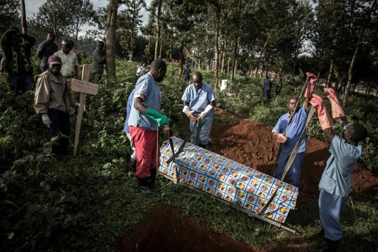 Health workers prepare to bury an Ebola victim in Butembo. More than 2,000 cases have been recorded since the disease broke out in eastern DR Congo 10 months ago