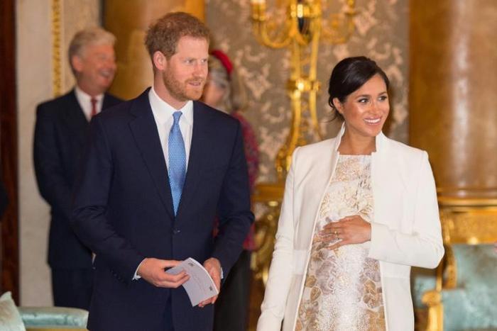 Britain's Meghan, Duchess of Sussex (R) has reportedly convinced Prince Harry to eat less meat, joining in her vegan diet during the week