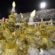 Members of the Viradouro school samba through the 700 meter Sambradrome in Rio's carnival: each school fields hundreds, if not thousands, of dancers, as well as floats and drummers