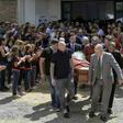 Nantes' French defender Nicolas Pallois (C-L), Emiliano Sala's brother Dario (L) and their father Horacio Sala (R-back), along with relatives and friends carry the late footballer's coffin the funeral service in Progreso, Argentina
