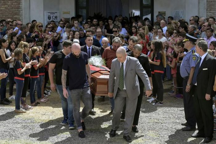 Nantes' French defender Nicolas Pallois (C-L), Emiliano Sala's brother Dario (L) and their father Horacio Sala (R-back), along with relatives and friends carry the late footballer's coffin the funeral service in Progreso, Argentina