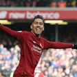 Roberto Firmino celebrates scoring Liverpool's third goal in their Premier League match against Burnley at Anfield