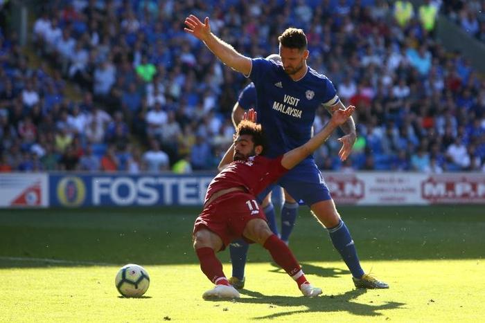 Liverpool's Egyptian forward Salah is fouled by Cardiff defender Morrison