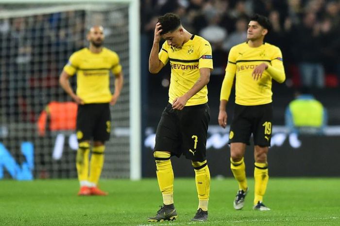 England winger Jadon Sancho (C) looks shellshocked after Dortmund's 3-0 first-leg defeat by Tottenham
