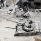 Syrian soldiers advance in an area on the eastern outskirts of Douma on April 8, 2018