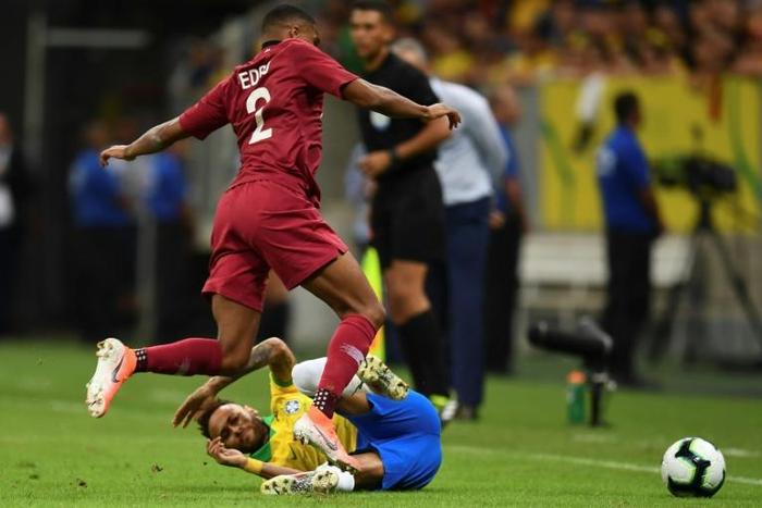 Brazil star Neymar tackles Qatar's Pedro Correira before leaving the field with an injury in a friendly on Wednesday