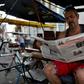 A man reads a slimmed-down edition of Cuban daily Granma in Havana, part of the country's first newspaper cut since 1990