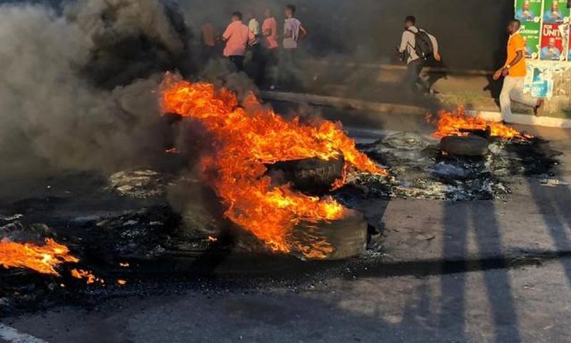 Youth burn tyres