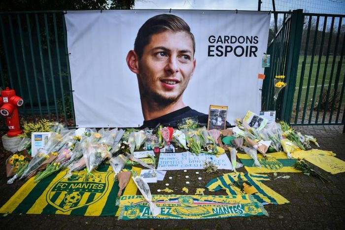 A picture shows flowers put in front of the entrance of the training center La Joneliere in La Chapelle-sur-Erdre on January 25, 2019, four days after the plane of Argentinian forward Emiliano Sala vanished during a flight from Nantes,