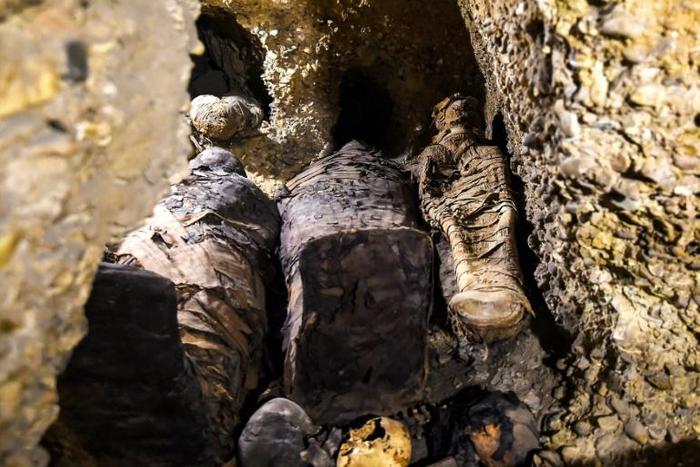 Newly-discovered mummies wrapped in linen found in burial chambers dating to the Ptolemaic era (323-30 BC) at the necropolis of Tunah Al-Gabal in Egypt's southern Minya province