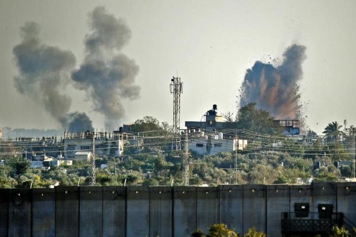 Israel launched a wave of strikes on Gaza after it said Palestinian militants in the Strip fired hundreds of rockets into Israeli territory