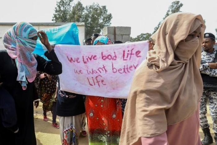 Migrants get their message across during the UN head's visit Thursday