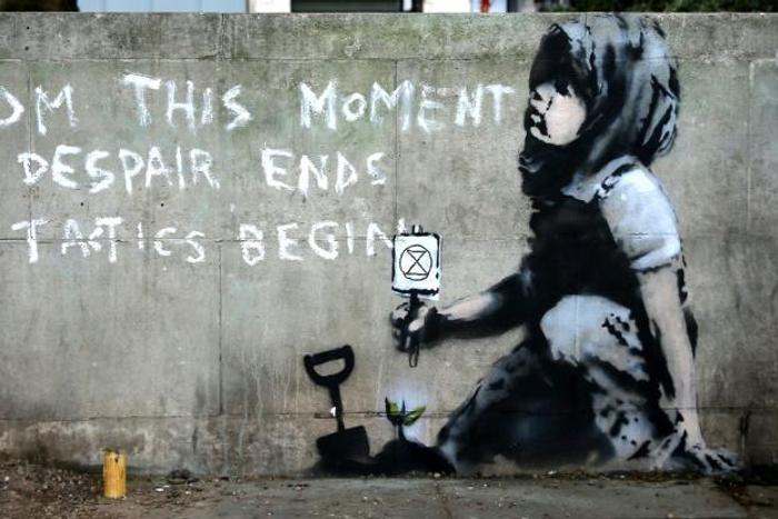 The graffiti artwork near Marble Arch, widely believed to be the work of street artist Banksy, captures the essence of the Extinction Rebellion climate change protest