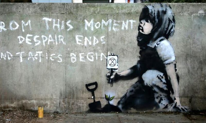 The graffiti artwork near Marble Arch, widely believed to be the work of street artist Banksy, captures the essence of the Extinction Rebellion climate change protest