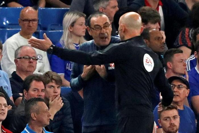 Chelsea manager Maurizio Sarri, pictured being directed away from the technical area by fourth official Roger East, was sent off against Burnley
