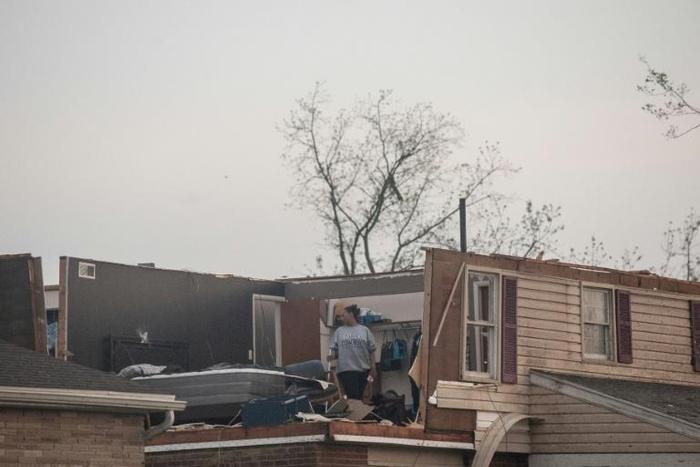 Trotwood, Ohio residents inspect damage to their homes following powerful tornados on May 28