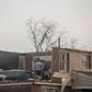 Trotwood, Ohio residents inspect damage to their homes following powerful tornados on May 28