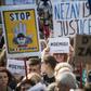 A demonstrator holds a placard reading "#Demisi" (C) during a protest against the government led by Andrej Babis in Wenceslas Square in Prague, Czech Republic on May 21, 2019
